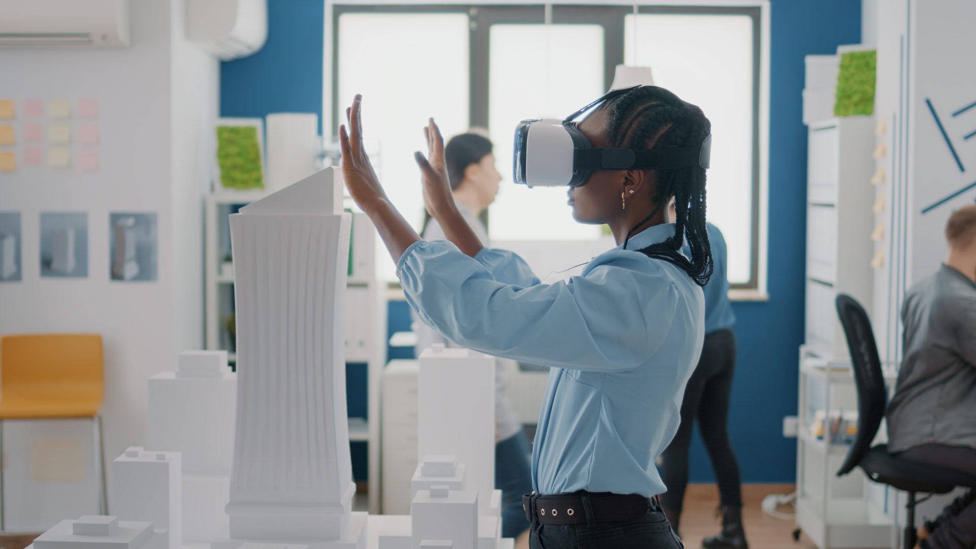 Close up of engineer working with vr glasses to plan building model and architectural layout. Architect designing construction structure, using virtual reality headset for development.